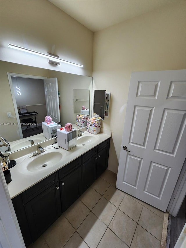 bathroom featuring tile patterned floors and vanity