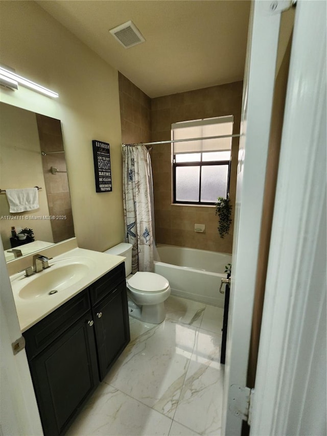 full bathroom featuring vanity, toilet, and shower / tub combo with curtain