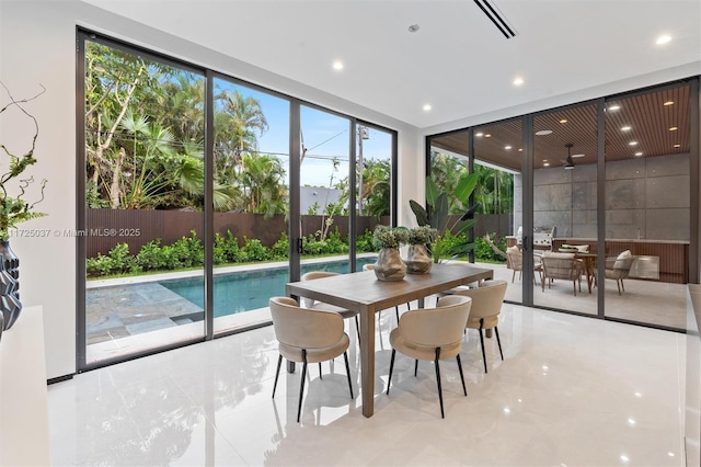 dining room featuring a wealth of natural light and expansive windows