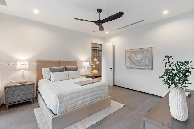 bedroom featuring ceiling fan and concrete flooring