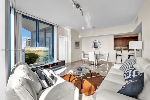 living room featuring floor to ceiling windows