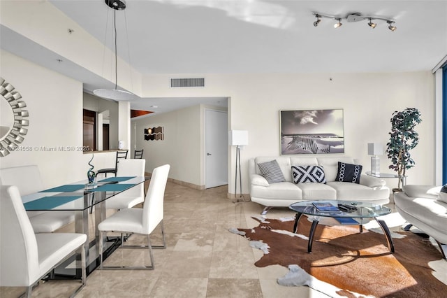 living room with light tile patterned floors