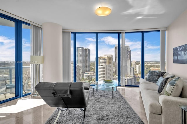 tiled living room with floor to ceiling windows