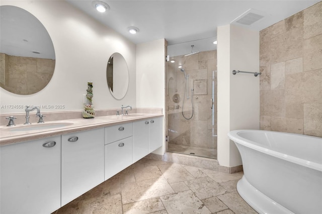 bathroom featuring vanity and plus walk in shower