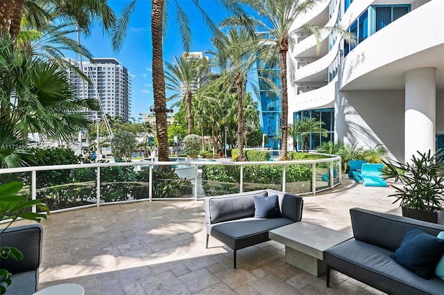 view of patio with a balcony and an outdoor hangout area