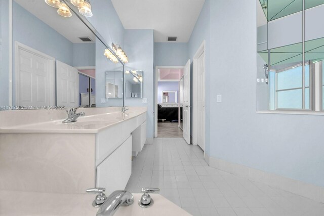 bathroom with vanity and tile patterned flooring