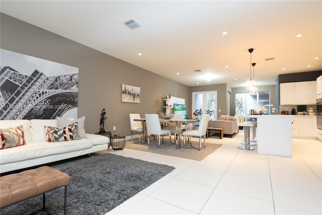 tiled living room featuring sink