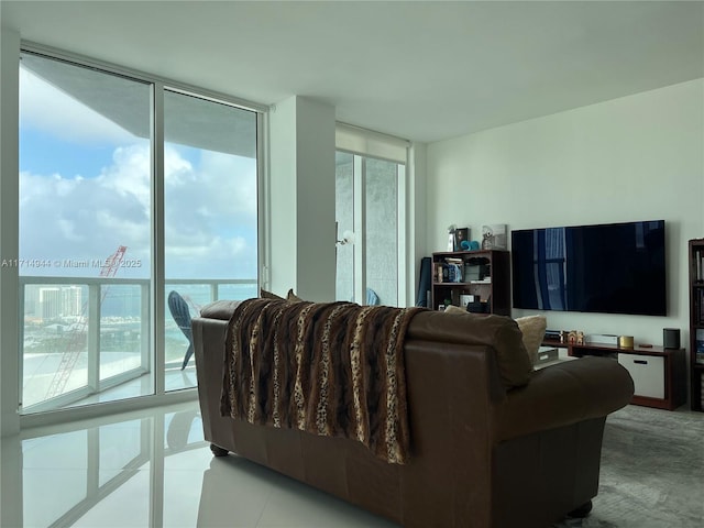 living room with light tile patterned floors and expansive windows