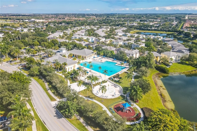 birds eye view of property featuring a water view and a residential view