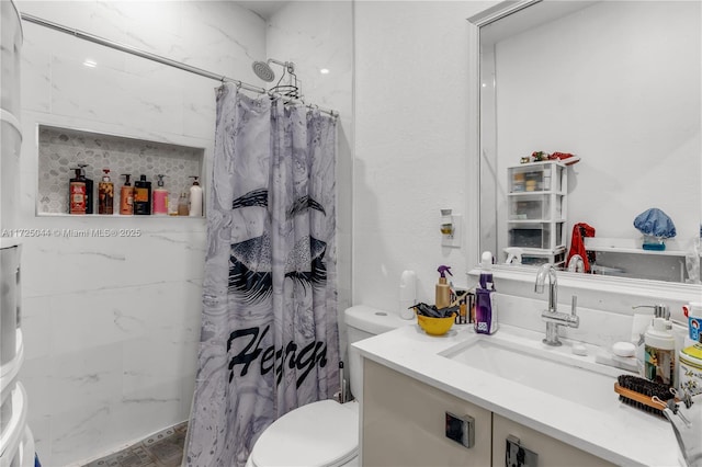 full bathroom featuring toilet, vanity, and a shower with shower curtain