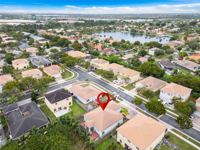 aerial view featuring a water view and a residential view