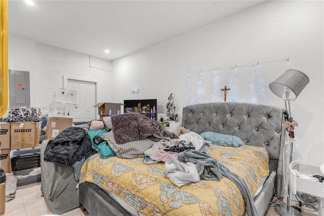 bedroom featuring recessed lighting, electric panel, and light tile patterned floors