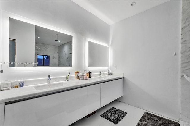 bathroom featuring walk in shower, tile patterned floors, and vanity