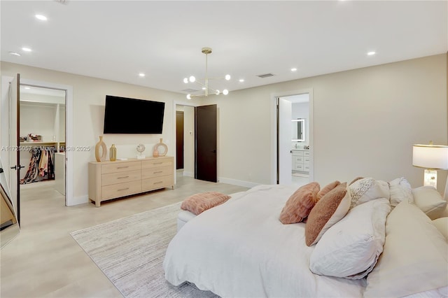 bedroom with a chandelier, recessed lighting, visible vents, baseboards, and a walk in closet