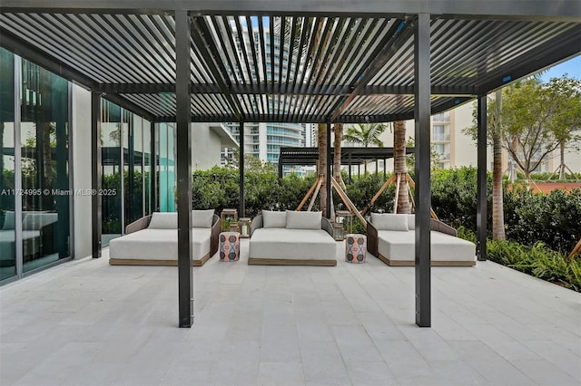 view of patio featuring outdoor lounge area and a pergola