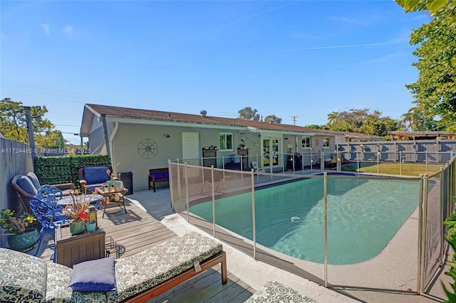 view of pool with a wooden deck