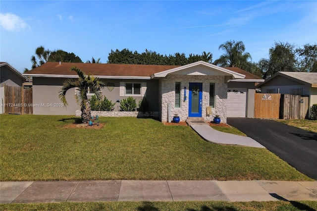 single story home with a front yard and a garage