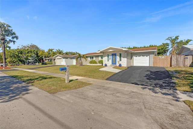 single story home with a front yard and a garage