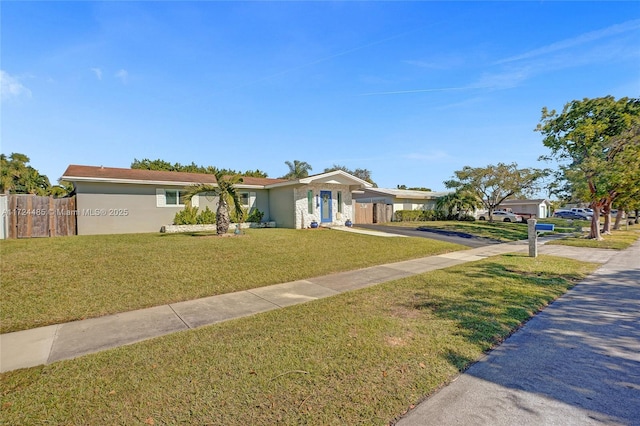 single story home featuring a front yard