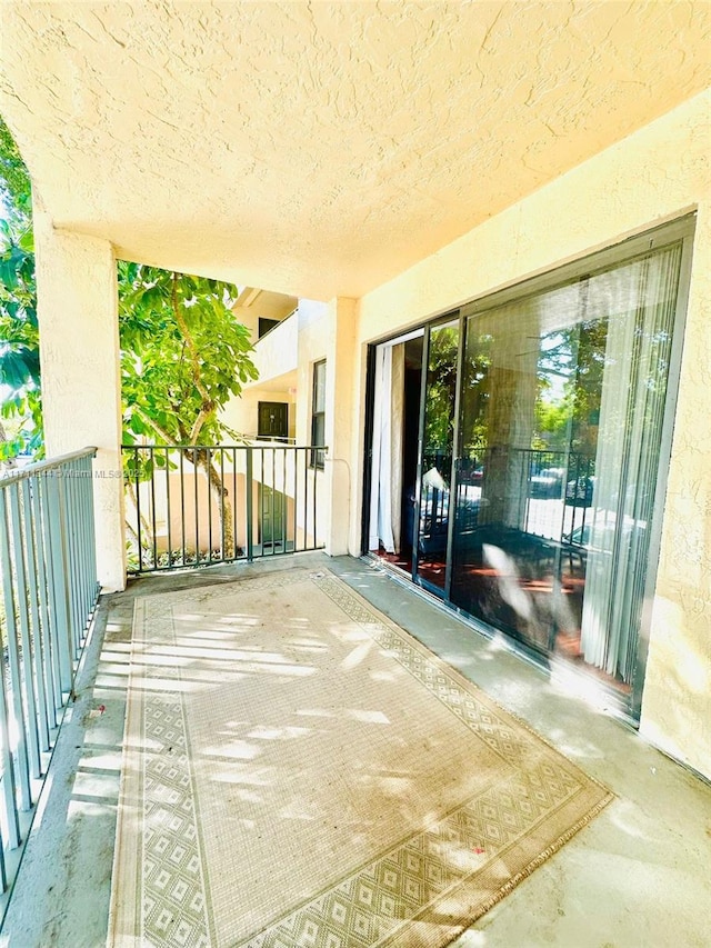 view of patio with a balcony