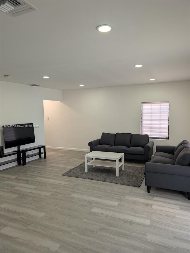 living room with light hardwood / wood-style floors