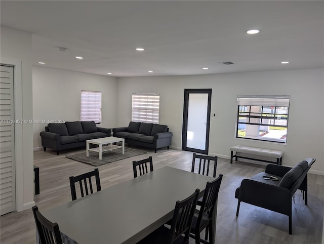 dining space with light hardwood / wood-style flooring