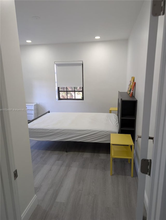 bedroom featuring hardwood / wood-style flooring