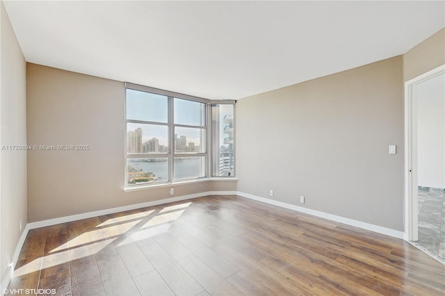 spare room featuring hardwood / wood-style flooring