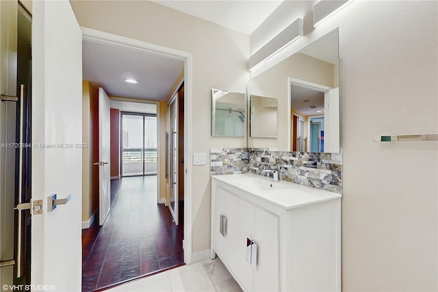 bathroom with vanity and backsplash