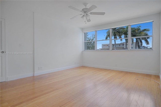 9381 E Bay Harbor Dr Unit 301N, Bay Harbor Islands, FL 33154 - empty room with light wood-style floors, baseboards, and a ceiling fan