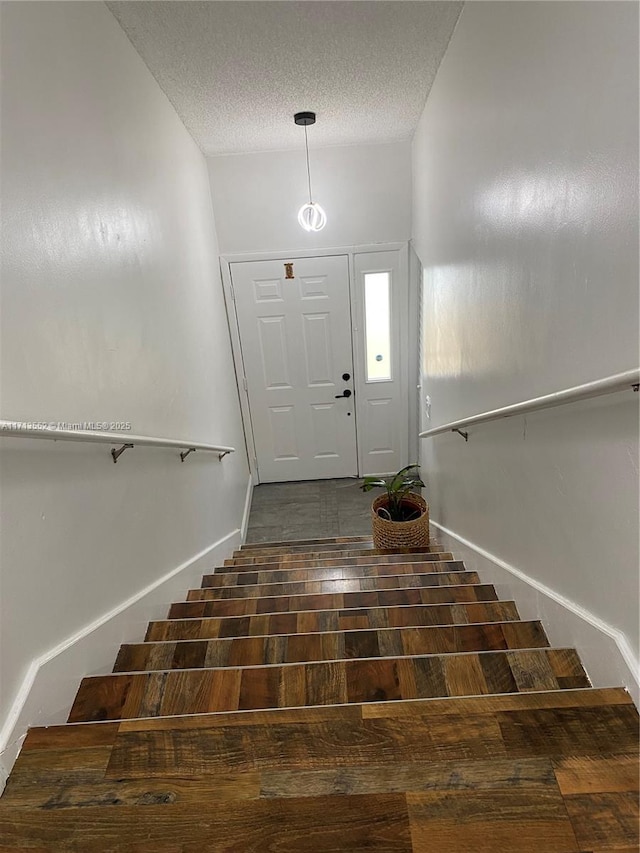2278 SE 27th Dr Unit 201-G, Homestead, FL 33035 - stairs with a towering ceiling and a textured ceiling