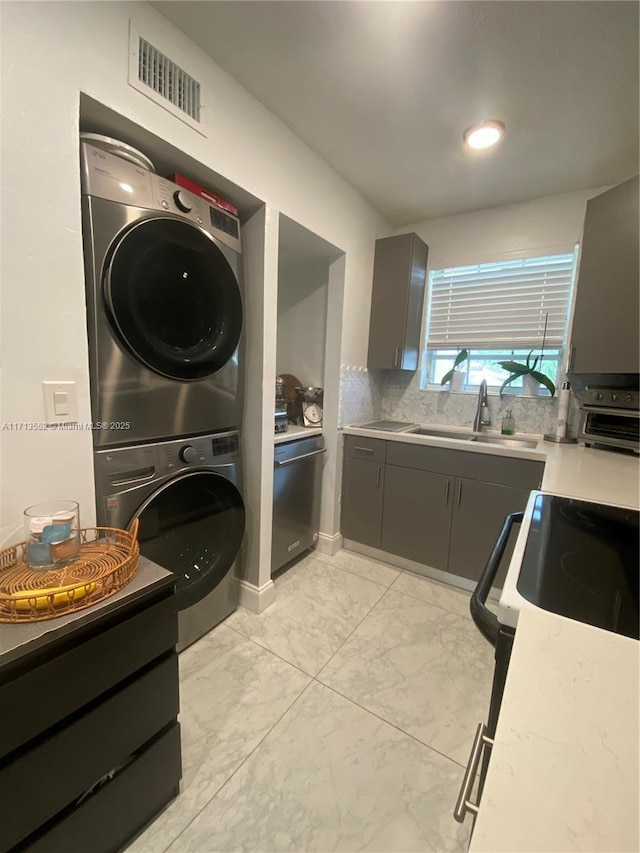 2278 SE 27th Dr Unit 201-G, Homestead, FL 33035 - laundry area featuring sink and stacked washer / dryer