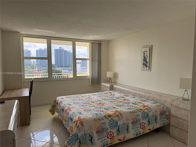 3180 S Ocean Dr Unit 721, Hallandale Beach, FL 33009 - bedroom with a view of city, light tile patterned floors, and a textured ceiling