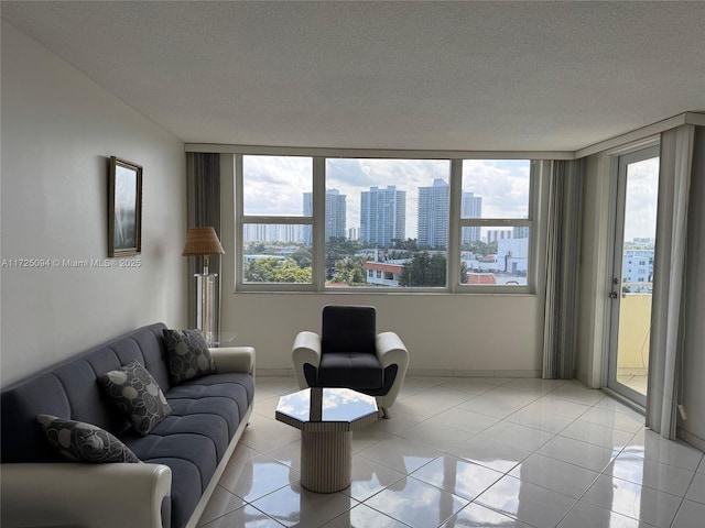 3180 S Ocean Dr Unit 721, Hallandale Beach, FL 33009 - living area featuring light tile patterned floors, a textured ceiling, plenty of natural light, and a city view