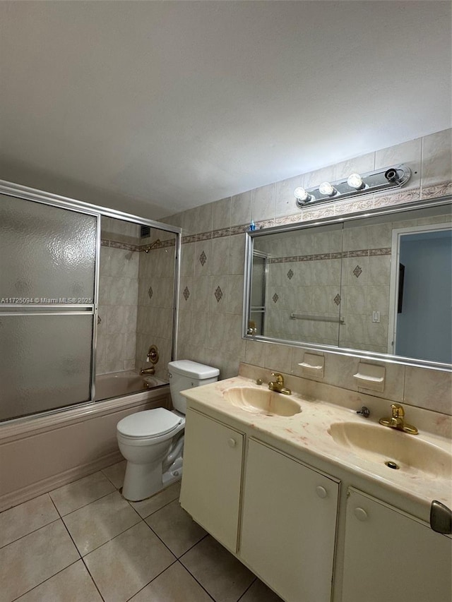 3180 S Ocean Dr Unit 721, Hallandale Beach, FL 33009 - bathroom with a sink, tile patterned floors, tile walls, and shower / bath combination with glass door
