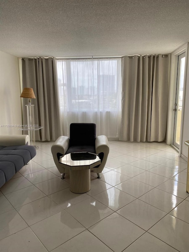 3180 S Ocean Dr Unit 721, Hallandale Beach, FL 33009 - living room with a textured ceiling and light tile patterned flooring