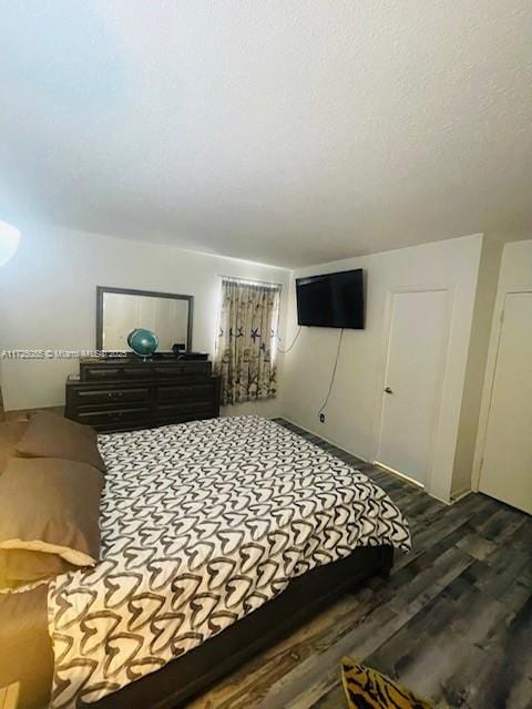 bedroom featuring dark hardwood / wood-style floors