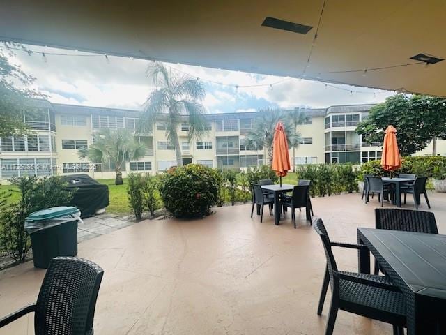 4441 NW 16th St Unit J311, Lauderhill, FL 33313 - view of patio / terrace with outdoor dining area