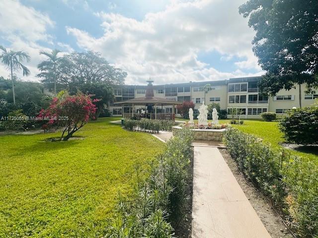 4441 NW 16th St Unit J311, Lauderhill, FL 33313 - view of property's community with a yard