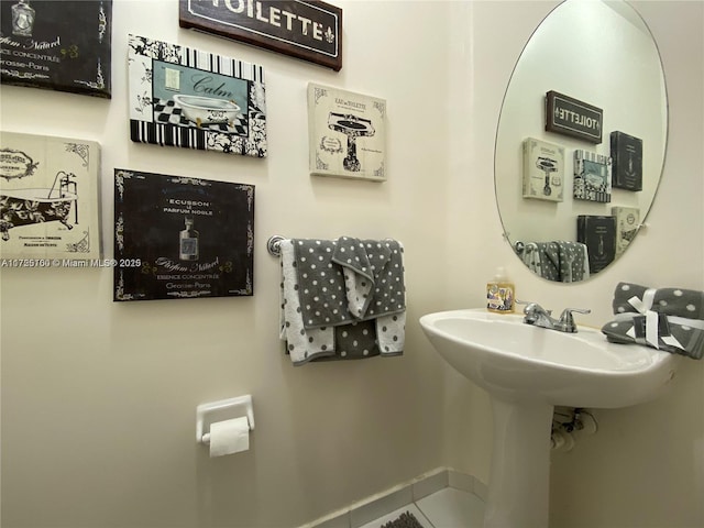 bathroom with tile patterned floors