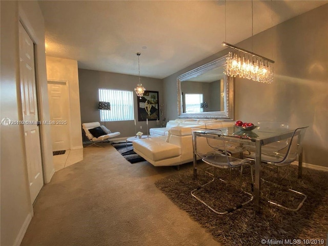 dining room featuring carpet flooring