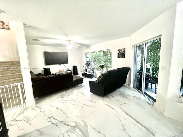 living room featuring ceiling fan