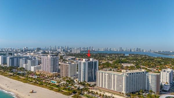 birds eye view of property with a view of the beach and a water view