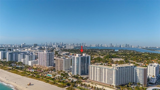 aerial view featuring a water view and a beach view