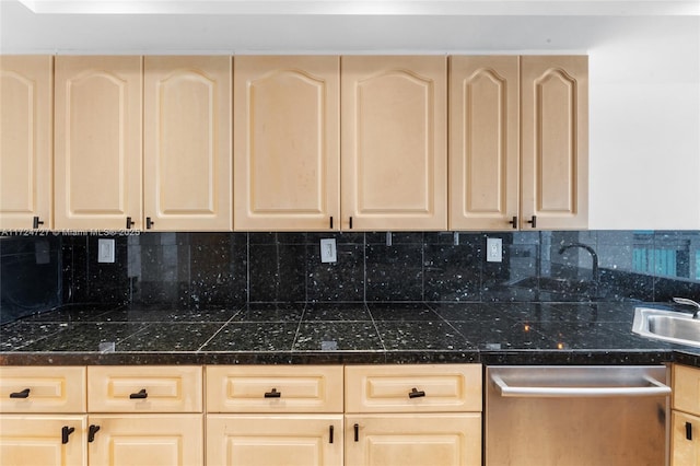 kitchen featuring stainless steel dishwasher, light brown cabinets, and decorative backsplash