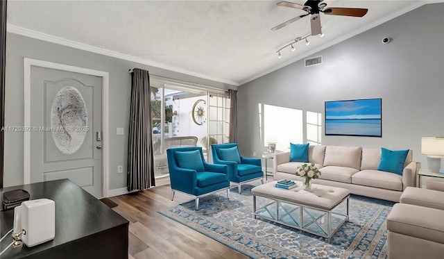 living room featuring ornamental molding, ceiling fan, lofted ceiling, and wood-type flooring