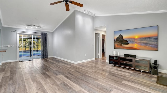 living room featuring ceiling fan, track lighting, crown molding, and a textured ceiling