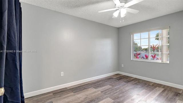 spare room featuring a textured ceiling, ceiling fan, and wood-type flooring