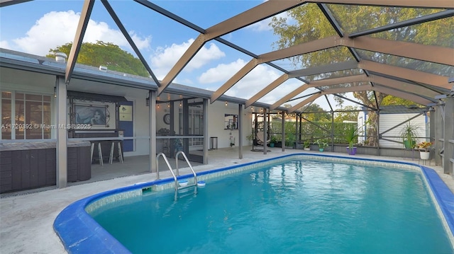 view of swimming pool featuring a lanai and a patio