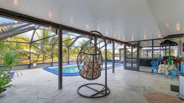 unfurnished sunroom featuring a swimming pool and a wealth of natural light